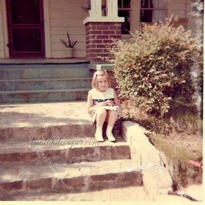 Here I am sitting on the front steps at Red Oak with that wonderful front porch seen behind me.